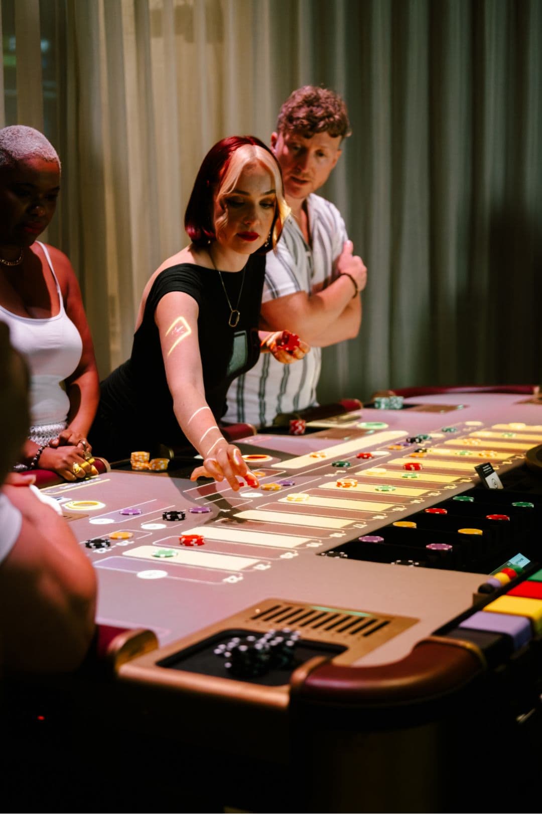 Guests at High Roller games table
